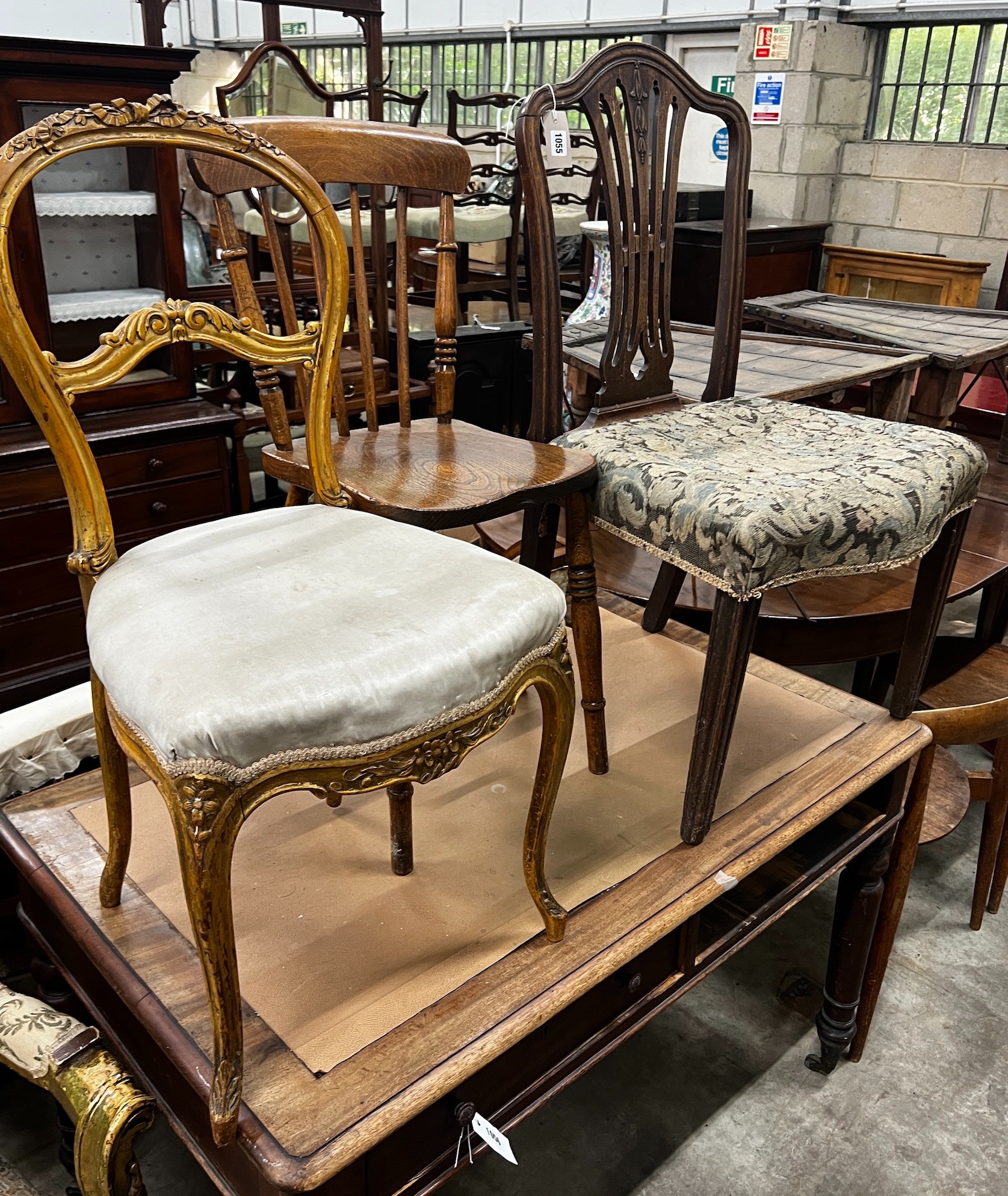 A George III mahogany dining chair, A Victorian elm and beech Windsor kitchen chair and a giltwood balloon back chair